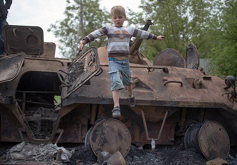 May, 14&lt;br>Burned military equipment at the entrance to the city of Slovyansk