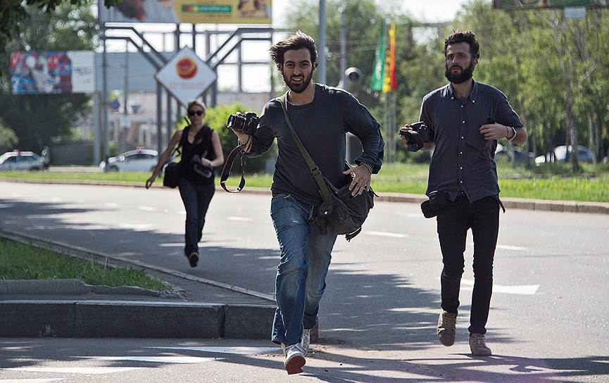 May, 26&lt;br>Journalists running away during the shelling near the airport of Donetsk