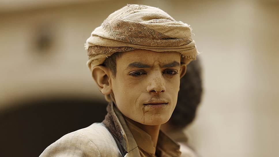 Сана, Йемен. Ребенок, отработавший целый день на ферме