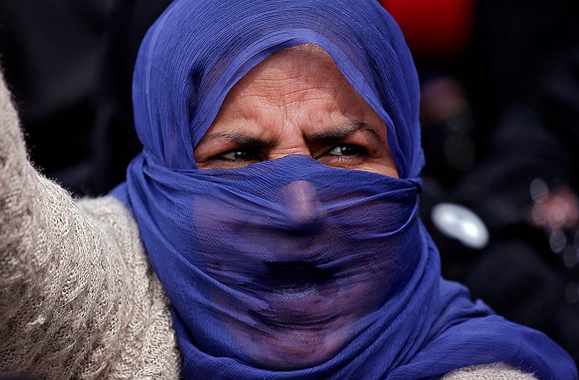 Округ Катхуа, Индия. Местная жительница во время акции протеста после изнасилования восьмилетней девочки