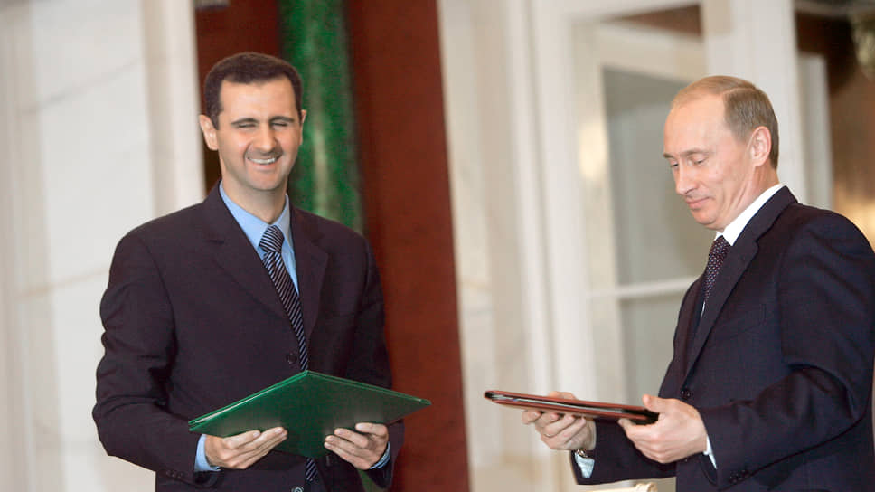 Президент России Владимир Путин (справа) и президент Сирии Башар Асад во время встречи в Георгиевском зале Большого Кремлевского дворца, 2005 год
