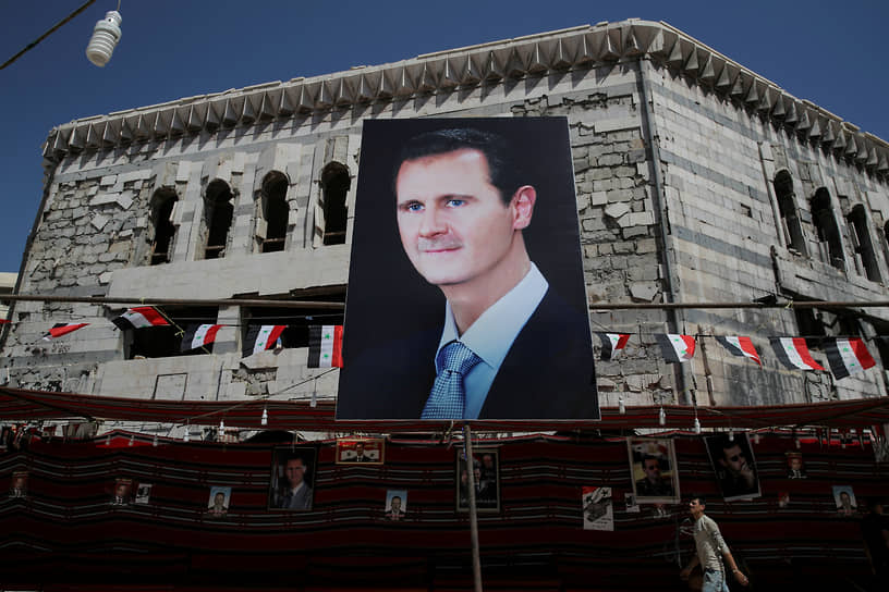 Баннер с фотографией президента Сирии Башара Асада