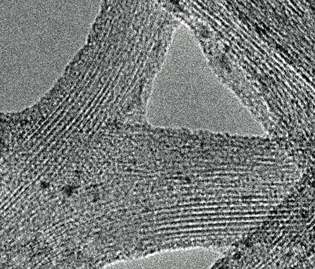 Электронно-микроскопическое изображение пучка ОУН (вид сбоку) представляющего собой одномерный
кристалл