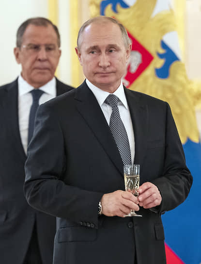 Президент России Владимир Путин и министр иностранных дел Сергей Лавров