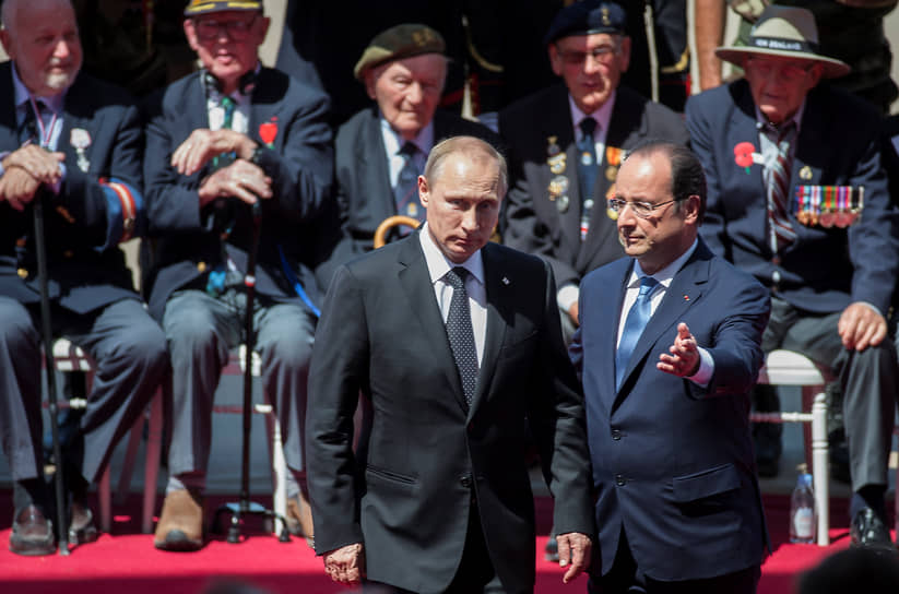 Президент России Владимир Путин и президент Франции Франсуа Олланд на праздновании 70-й годовщины высадки союзников в Нормандии в 2014 году
