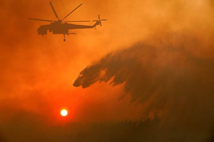 Лесные пожары, подбирающиеся к Афинам,— тревожная визитная карточка уже не первого лета в Греции 