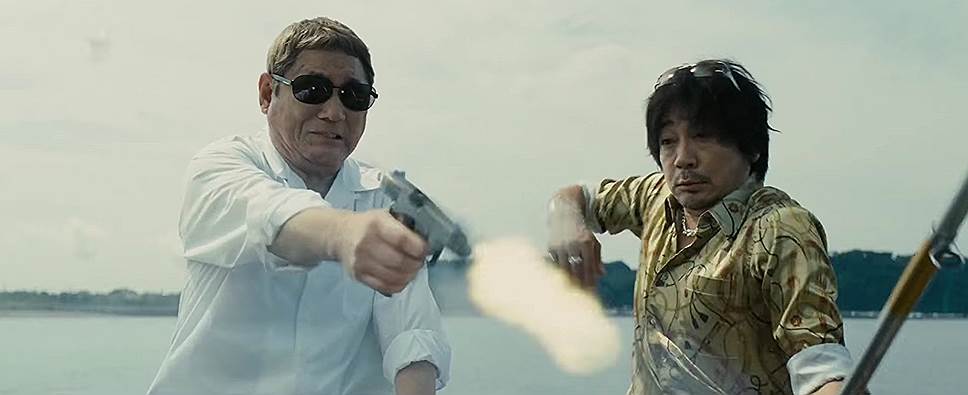 Роль опытного якудза по имени Отомо во всех трех фильмах сыграл сам Такэси Китано (слева)  

