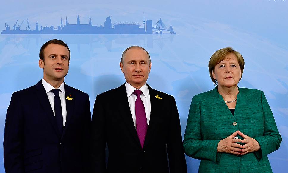 Слева направо: президент Франции Эмманюэль Макрон, президент России Владимир Путин и канцлер Германии Ангела Меркель