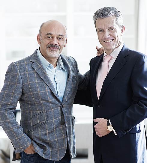 Французский дизайнер Кристиан Лубутен (слева) и генеральный менеджер Jaeger-LeCoultre Даниэль Риедо 
