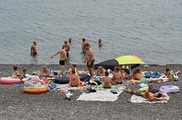 Tourists on wild beaches on the Black Sea coast.