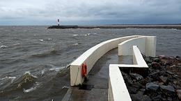 The complex of protective structures in St. Petersburg (dam) during a stormy wind and the threat of flooding - a closed navigational facility on the main ship fairway in the Gulf of Finland.