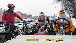 Traditional winter bicycle parade of Fathers Frost and Snow Maidens in St. Petersburg.
