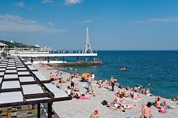 Holiday season in Crimea. Vacationers on the Massandra beach.